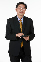 One businessman in black formal suit stand touching glasses and look tablet in hand. Studio shoot with white background. Concept for investment, news, technology, future.