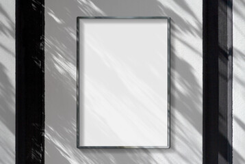 Wall Mural - Metal frame hanging in street mockup. Template of a picture framed on a wall bathed in sunlight 3D rendering