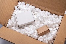 Cardboard Box On Loose White Filler Shipping Packing Peanuts