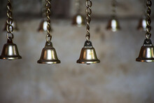 Small Bell Group Hanging On The Chain. Lucky Symbol. Selective Focus