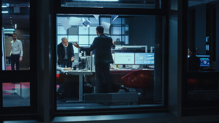 Poster - Shot from Outside the Window: Business Meeting Goes Out of Hand When Managers Start to Argue Over Financial Charts and Stock Prices. Crisis Reaches Peak when Employee Throws Papers in the Air.