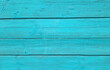 The wooden boards are painted turquoise. Background from boards