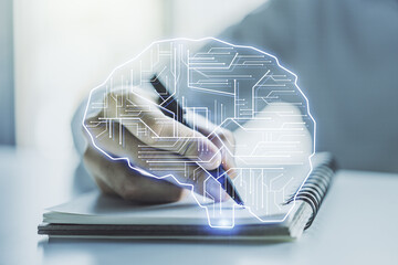 Double exposure of creative human brain microcircuit with man hand writing in notepad on background. Future technology and AI concept