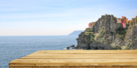 Wall Mural - Summer background of wooden desk and landscape of Italy 