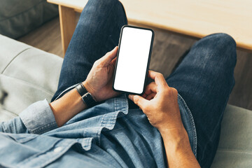 cell phone blank white screen mockup.hand holding texting using mobile on desk at office.background empty space for advertise.work people contact marketing business,technology