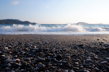 Wall Mural - beach view with small stones and waves