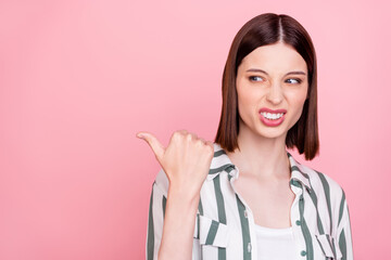 Wall Mural - Photo of sad brunette millennial lady point look empty space wear white shirt top isolated on pink color background