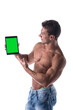 © theartofphoto - Sexy muscular shirtless young man holding a blank tablet PC