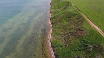 Sticker - Taman Bay, Strait of Kerch,  Azov sea, Russia. Aerial video of cliffed coast line tract White Cliff line the shore of Azov sea. 