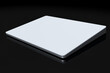 Silver computer trackpad or wireless touch pad isolated on black background