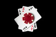 Poker game with three of a kind  or set combination. Chips and cards on the black table in poker club