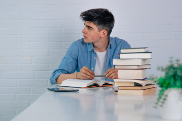 Wall Mural - student at home at desk looking sideways with copy space