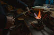 © ADDICTIVE STOCK - Crop jeweler melting metal with torch