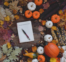 Wall Mural - Thanksgiving dinner menu planning surrounded by fall decorations