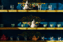 Composition Of Ornamental Tea Sets On Shelves