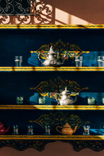 Composition Of Ornamental Tea Sets On Shelves