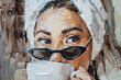 © Mariia - The girl in black glasses and a white robe. A towel is tied on her head. A woman is drinking coffee. Oil painting on canvas.