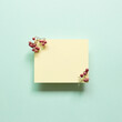 Yellow memo pad with red fruits on blue background. top view, copy space
