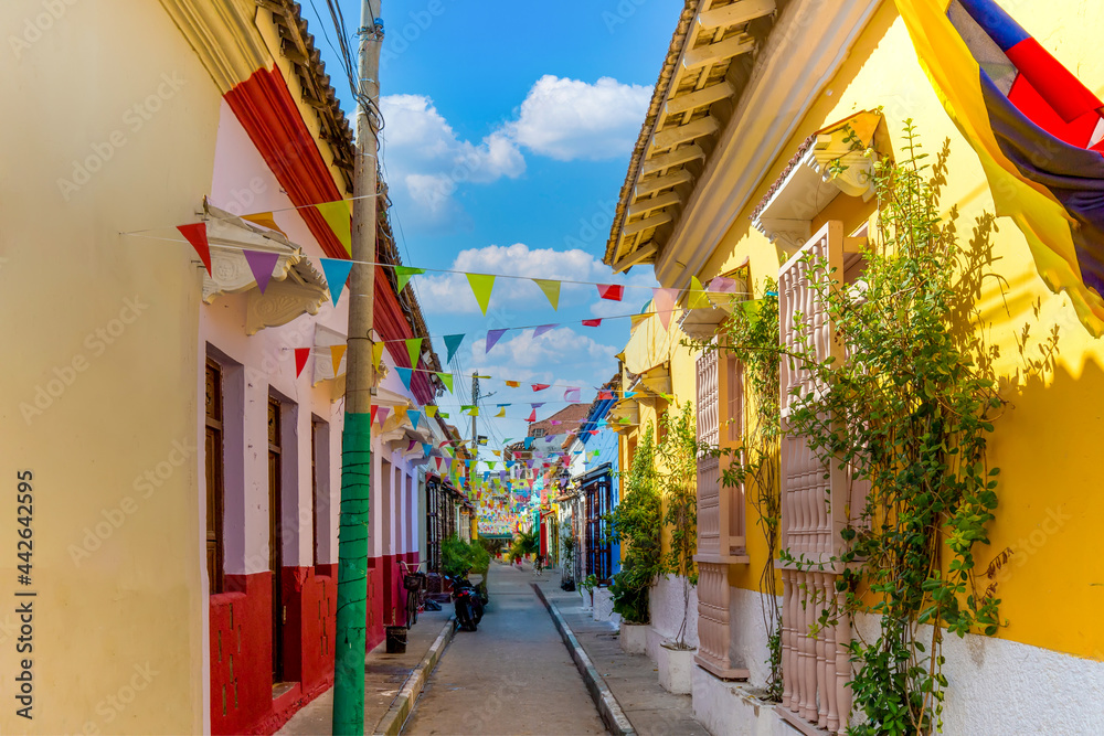 Colombia, Scenic colorful streets of Cartagena in historic Getsemani district near Walled City, Ciudad Amurallada, a UNESCO world heritage site. - obrazy, fototapety, plakaty 