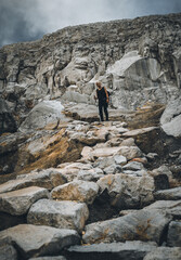 A woman standing at the crater of mount Ijen Banyuwangi Indonesia.