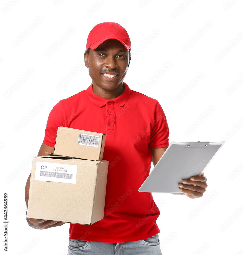 African-American delivery man with parcels on white background