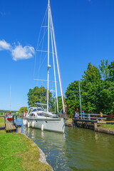 Wall Mural - Sailboat in the beautiful Gota canal in sweden