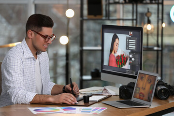 Fototapete - Professional retoucher working on computer in office