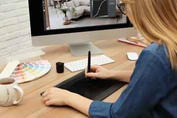 Poster - Professional retoucher working on graphic tablet at desk, closeup