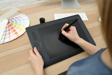 Poster - Professional designer working on graphic tablet at desk, closeup