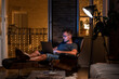 © ADDICTIVE STOCK - Male freelancer working in evening at home