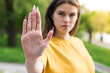 © Павел Костенко - Close up of the hand of a beautiful and young Caucasian girl showing Stop Sign