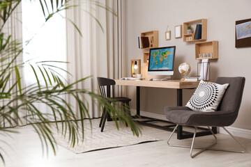 Room interior with comfortable workplace. Modern computer on wooden desk