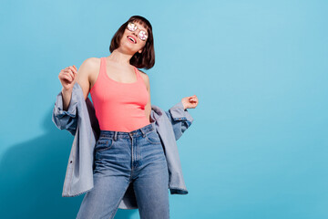 Sticker - Portrait of attractive dreamy cheerful girl posing having fun copy space pastime isolated over bright blue color background