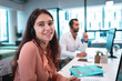© Wavebreak Media - Portrait of caucasian businesswoman wearing headset and sitting at table
