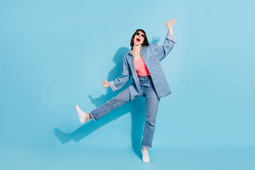 Poster - Full length body size view of attractive cheerful childish girl dancing having fun isolated over bright blue color background