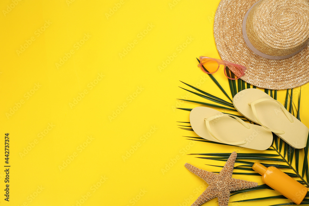 Flat lay composition with beach objects on yellow background, space for text - obrazy, fototapety, plakaty 