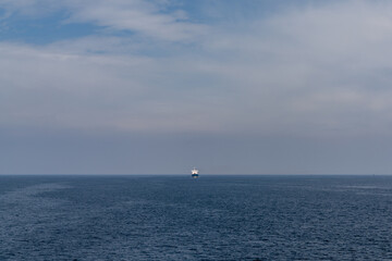 Sticker - large freight ship travelling full steam ahead and approaching from far away on the open ocean