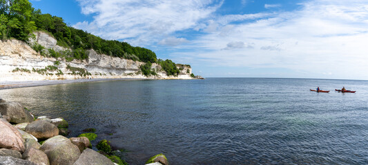 Sticker - group of sea kayakers paddling off the coast of Denmark at Stenvs Klint