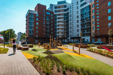 The courtyard of a modern residential building with equipments for workout and fitness outdoor activities.