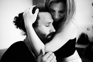 Girl giving support and comfort to a man during stress and depression