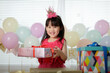 © M-image - young girl celebrating her 5th  birthday at home