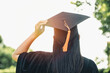 © Greanlnw studio - New student graduate carrying a graduation hat with sunshine and beautiful background