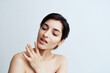 © SHOTPRIME STUDIO - pretty brunette with bare shoulders face skin care health light background
