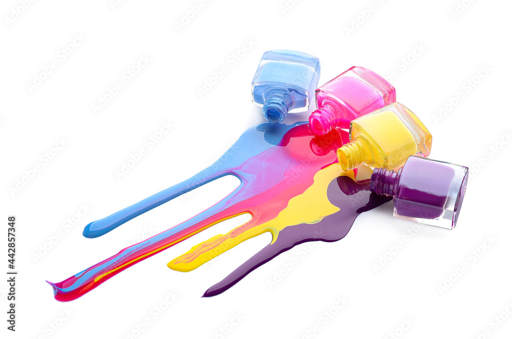 Different nail polishes on white background