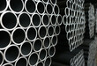 © Benjamin Salazar  - Steel round pipe packaging background for logistics process.
