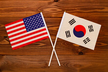 Flag Of USA And Flag Of South Korea Crossed With Each Other. USA Vs South Korea. The Image Illustrates The Relationship Between Countries. Photography For Video News On TV And Articles On The Internet