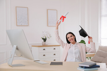 Poster - Happy student with graduation hat and diploma at workplace in office