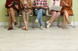 © New Africa - People waiting for job interview indoors, closeup