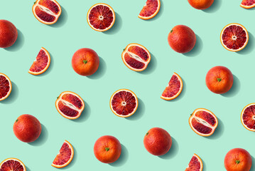 Wall Mural - Colorful fruit pattern of fresh whole and sliced blood orange