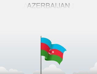 Azerbaijan flag flutters on a pole standing tall under a white sky